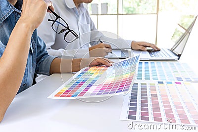 Team of colleague graphic designer drawing and retouching image Stock Photo