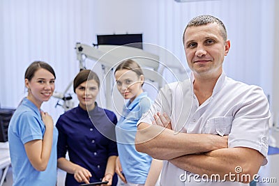 Team of colleagues dentists, portrait of doctors looking at the camera in dental office Stock Photo