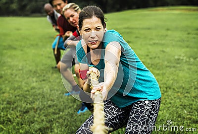 Team competing in tug of war Stock Photo