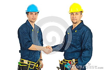 Team of constructor workers give handshake Stock Photo