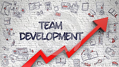 Team Development Drawn on White Brick Wall. Stock Photo