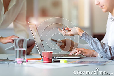 Team discussing Project pointing on Computer at modern Office Stock Photo