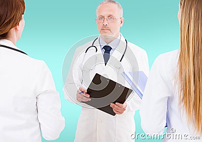 Team of doctors discussing something isolated on blue background,mock up Stock Photo