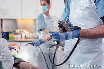 Team of doctors performing endoscopy in hospital Stock Photo