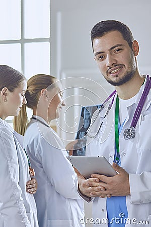 Team of doctors watching x-ray image in a hospital Stock Photo