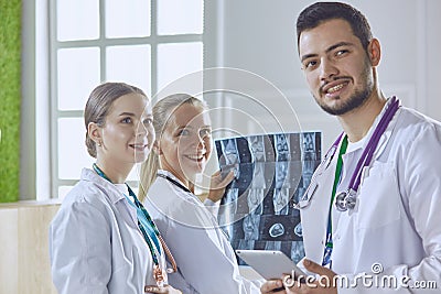 Team of doctors watching x-ray image in a hospital Stock Photo