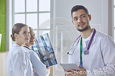 Team of doctors watching x-ray image in a hospital Stock Photo