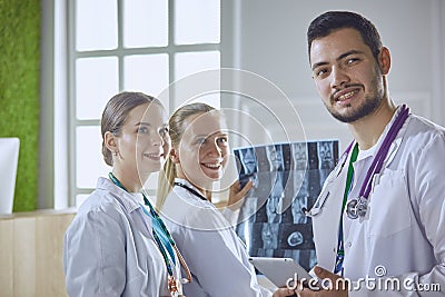 Team of doctors watching x-ray image in a hospital Stock Photo