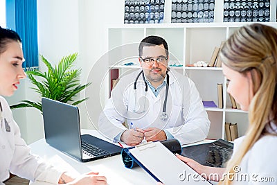 Team of doctors at working place Stock Photo