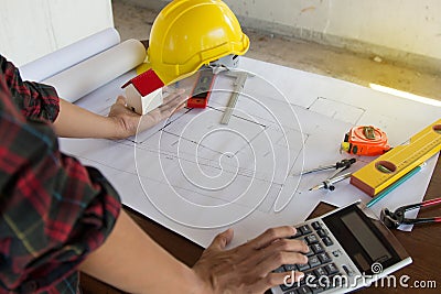 Team Engineer and Architect consult projct with blueprint at Construction Site Stock Photo