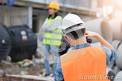 Team Engineering wearing yellow helmet and working Stock Photo