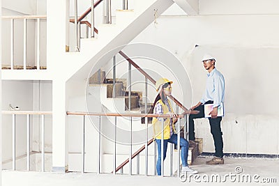 Team engineering work meeting together in construction site Stock Photo