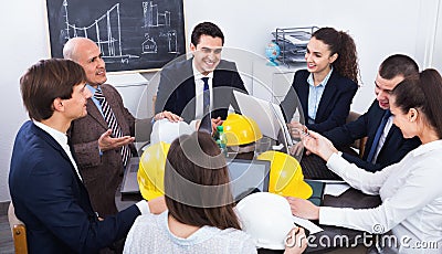 Team of engineers and architects discussing business project Stock Photo