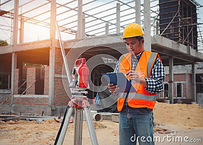 Team engineers checking and planning project working outdoors building side on a worksite, Engineering and architecture concept, Stock Photo
