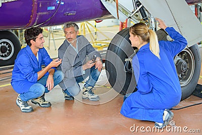 Team engineers fixing aiplane Stock Photo