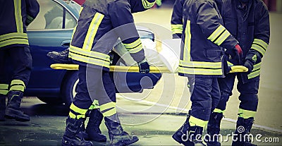 Team of firefighters rescued the injured after a tragic car acci Stock Photo