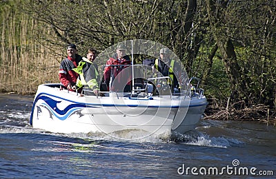 Team in fishing motorboat Stock Photo