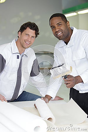 team happy painters smiling at camera Stock Photo