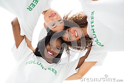 Team of happy volunteers embracing and looking down at camera Stock Photo