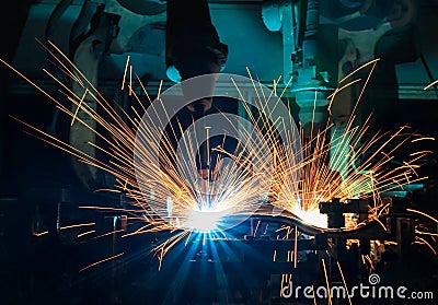 Industrial robot welding are movement welding car part in automotive industrial factory Stock Photo