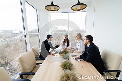 Team listen at meeting leader of project at conference table. Stock Photo