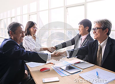 Team of man and woman business people successful shaking hand a Stock Photo