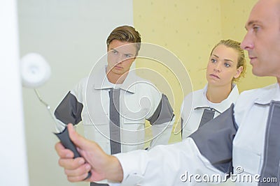 Team painters wall painting Stock Photo