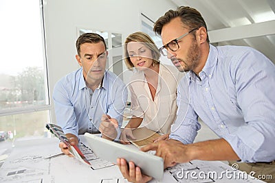 Team pf architects meeting and discussing new designs Stock Photo