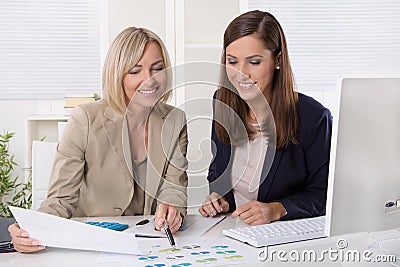 Team of successful businesswoman in the office working in leading positions. Stock Photo