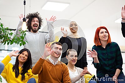 Team of successful multiethnic coworkers in modern office workplace. Waving. Diversity happines and success concept Stock Photo