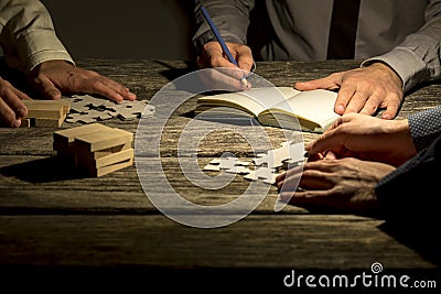 Team of three businessmen working on a project or assignment Stock Photo