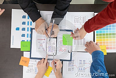 team of UI UX web designer are working together to develop mobile responsive websites with UI UX front end designer previews, UI Stock Photo