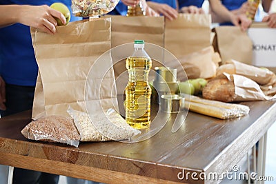 Team of collecting food donations at table, closeup Stock Photo