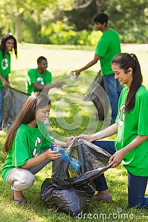 Team of volunteers picking up litter in park Stock Photo