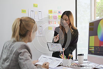 Team of website designer planning application development draft sketch drawing template layout framework at creative office Stock Photo