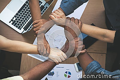 Close up of joining hands of businessman in unity Stock Photo