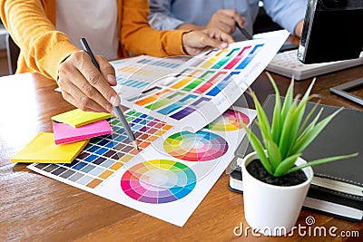 Team work for graphic design working on wood table Stock Photo