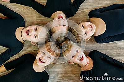 A team of young children do gymnastics in a dance class. The concept of sport, education, childhood, hobbies and dance Stock Photo