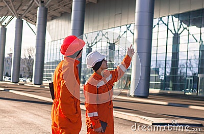 Team of young engineers discussing a construction project Stock Photo