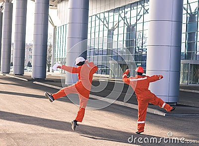 Team of young engineers happy jumping after heavy work. Stock Photo