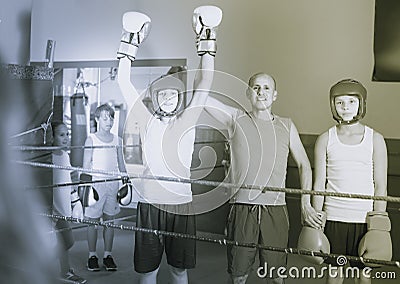 Team of young smiling boxer with coach standing Stock Photo