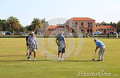 Teams of active senior citizens engaged in a game of lawn bowling at the Rotorua Bowling Club Editorial Stock Photo