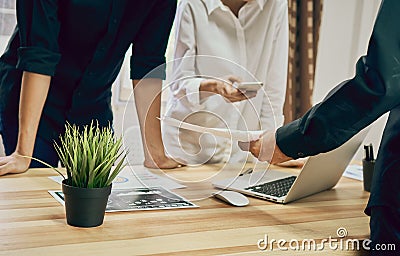 Teamwork is analyzing work strategies. To find the best way to grow a company Stock Photo