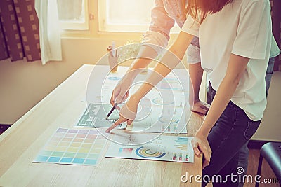 Teamwork is analyzing work strategies. To find the best way to grow a company. Stock Photo