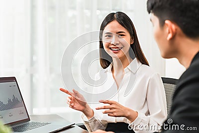 Teamwork Brainstorming Meeting and new startup project in the workplace, Smily Asian businesspeople working on laptop. Stock Photo