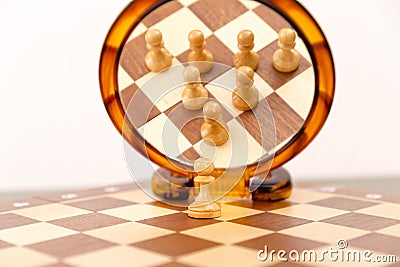 Teamwork concept, chess figures looking in mirror. One for all, Stock Photo