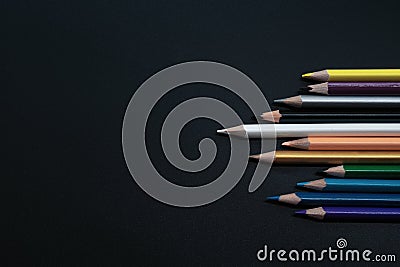 Teamwork concept. group of color pencil on black background Stock Photo