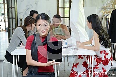 Teamwork designer concept : Fashion designer working near mannequin in office Stock Photo