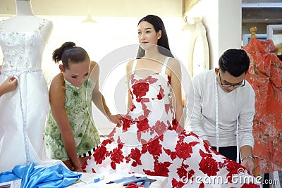 Teamwork designer concept : Fashion designer working near mannequin in office Stock Photo