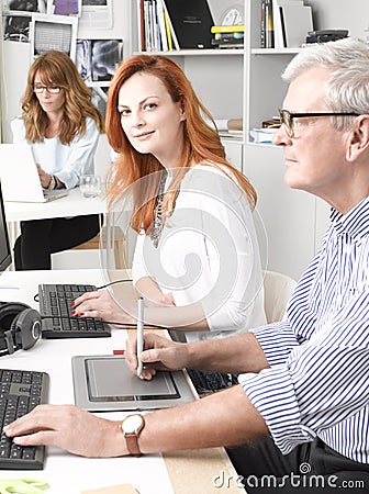 Teamwork in graphic design studio. Stock Photo